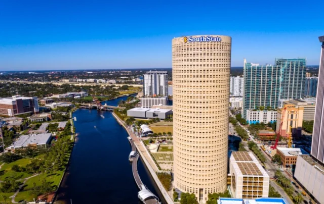 Downtown’s iconic @rivergate_tower is one of the most recognizable landmarks in Tampa’s skyline — but did you know it was designed to resemble a lighthouse? Opened in 1988 and designed by renowned architect Harry Wolf, the tower’s cylindrical form was meant to symbolize a beacon of economic energy radiating from the heart of #TampasDowntown.⁣ 

📐 Its proportions are based on the Fibonacci Series, giving the 31-story, 518,000+ square foot structure a unique sense of harmony and balance. 

Over the years, it’s earned a few local nicknames — from the playful “Beer Can Building” to “Tampa Tall Boy” and even “Stack of Pennies.” 🍻🪙 

What do you call it? And what’s your favorite tower in Tampa's Downtown? ⬇️ 

*Photo sourced from the official Rivergate Tower website.